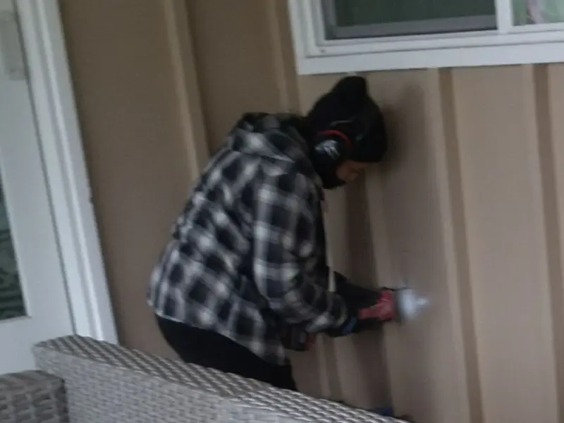 Professional electrician installing an exterior outlet in Wrightwood