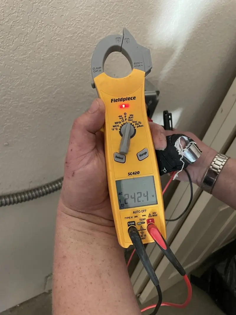 Voltage testing with clamp meter during Electrical Installation Services in Wrightwood